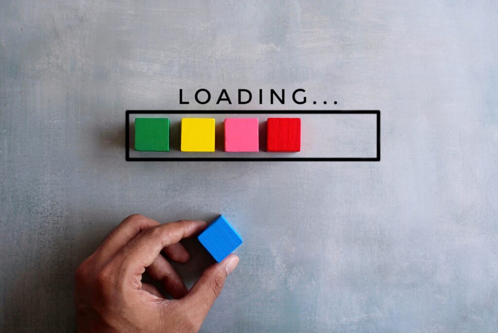 A loading bar comprised of multi-colored wooden blocks to illustrate slow growth